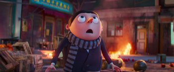 Movie still from “Minions: The Rise of Gru” (2022), directed by Jonathan del Val – An image of an animated character with a surprised look on his face; Medium shot, Low angle