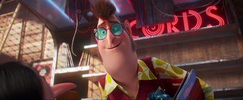 Movie still from “Minions: The Rise of Gru” (2022), directed by Jonathan del Val – A person wearing a red shirt and blue glasses; Close Up shot, Low angle