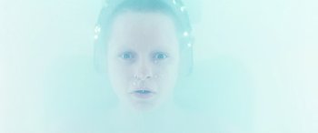 Movie still from “Minority Report” (2002), directed by Steven Spielberg – A young boy wearing headphones in the water; Close Up shot, Overhead angle