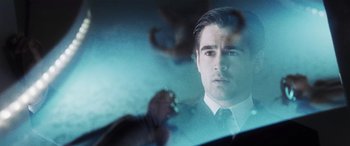 Movie still from “Minority Report” (2002), directed by Steven Spielberg – A person wearing a suit and tie; Close Up shot, Over the shoulder angle