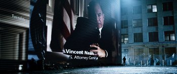 Movie still from “Minority Report” (2002), directed by Steven Spielberg – A billboard with a picture of vincent nash on it; Wide shot, Low angle