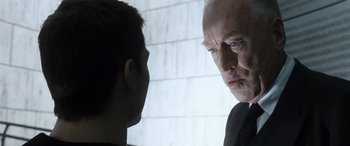 Movie still from “Minority Report” (2002), directed by Steven Spielberg – An older man and a younger man face to face; Close Up shot, Over the shoulder angle