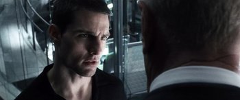 Movie still from “Minority Report” (2002), directed by Steven Spielberg – A man in black shirt and a man in black suit; Close Up shot, Over the shoulder angle