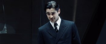 Movie still from “Minority Report” (2002), directed by Steven Spielberg – A man in a suit and tie looking to his left; Close Up shot, Over the shoulder angle