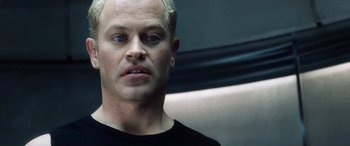 Movie still from “Minority Report” (2002), directed by Steven Spielberg – A person wearing a black t - shirt; Close Up shot, Low angle