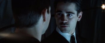 Movie still from “Minority Report” (2002), directed by Steven Spielberg – A man in a suit looking into a mirror; Close Up shot, Over the shoulder angle