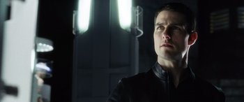Movie still from “Minority Report” (2002), directed by Steven Spielberg – A person wearing a black jacket; Close Up shot, Low angle