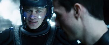 Movie still from “Minority Report” (2002), directed by Steven Spielberg – A man in a helmet and a man in a black suit; Close Up shot, Over the shoulder angle