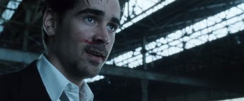 Movie still from “Minority Report” (2002), directed by Steven Spielberg – A person wearing a shirt; Close Up shot, Over the shoulder angle