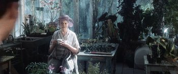 Movie still from “Minority Report” (2002), directed by Steven Spielberg – An older woman holding a cup in her hands; Medium shot, Low angle