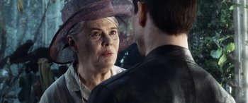Movie still from “Minority Report” (2002), directed by Steven Spielberg – An older woman wearing a hat looking at a younger man; Close Up shot, Over the shoulder angle
