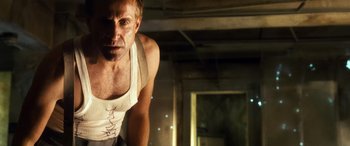 Movie still from “Minority Report” (2002), directed by Steven Spielberg – A person wearing a tank top; Close Up shot, Low angle