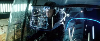 Movie still from “Minority Report” (2002), directed by Steven Spielberg – A man in a helmet is sitting in a helicopter; Medium shot, Over the shoulder angle