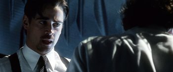 Movie still from “Minority Report” (2002), directed by Steven Spielberg – A man and a woman sitting next to each other in a room; Close Up shot, Over the shoulder angle