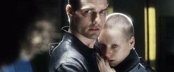 Movie still from “Minority Report” (2002), directed by Steven Spielberg – A man and a woman are holding each other's head; Close Up shot, Over the shoulder angle