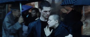 Movie still from “Minority Report” (2002), directed by Steven Spielberg – A man and a woman in a black leather jacket; Close Up shot, Low angle