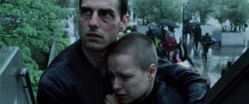 Movie still from “Minority Report” (2002), directed by Steven Spielberg – A man and a woman hugging in the rain; Close Up shot, Low angle