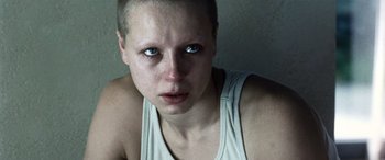 Movie still from “Minority Report” (2002), directed by Steven Spielberg – A person wearing a tank top; Close Up shot, Low angle