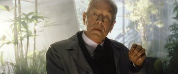 Movie still from “Minority Report” (2002), directed by Steven Spielberg – An older man wearing a suit and tie; Close Up shot, Low angle