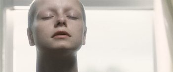 Movie still from “Minority Report” (2002), directed by Steven Spielberg – A woman with her eyes closed with her eyes closed; Extreme Close Up shot, Low angle