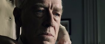 Movie still from “Minority Report” (2002), directed by Steven Spielberg – An older man with a serious look on his face; Close Up shot, Low angle