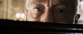 Movie still from “Minority Report” (2002), directed by Steven Spielberg – An older man with blue eyes looking at the camera; Extreme Close Up shot, Low angle