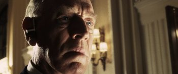 Movie still from “Minority Report” (2002), directed by Steven Spielberg – An older man with blue eyes looking out a window; Close Up shot, Low angle