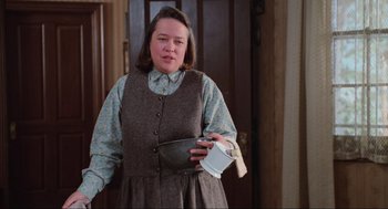 Movie still from “Misery” (1990), directed by Rob Reiner – A woman holding a bowl in her hands; Medium shot, High angle