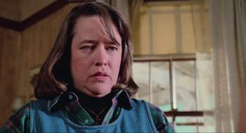 Movie still from “Misery” (1990), directed by Rob Reiner – A person wearing a jacket; Close Up shot, Low angle