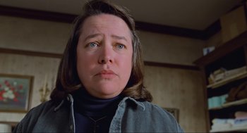 Movie still from “Misery” (1990), directed by Rob Reiner – A person wearing a jacket; Close Up shot, Low angle
