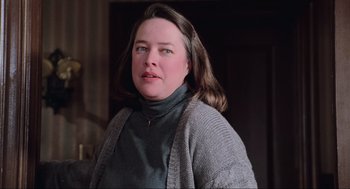 Movie still from “Misery” (1990), directed by Rob Reiner – A person wearing a sweater; Close Up shot, Low angle