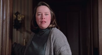 Movie still from “Misery” (1990), directed by Rob Reiner – A person wearing a sweater; Close Up shot, Low angle