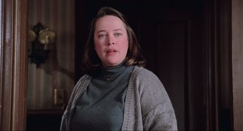Movie still from “Misery” (1990), directed by Rob Reiner – A person wearing a sweater; Close Up shot, Low angle