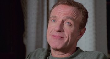 Movie still from “Misery” (1990), directed by Rob Reiner – A person with his mouth wide open; Close Up shot, Low angle