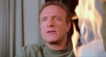 Movie still from “Misery” (1990), directed by Rob Reiner – A person looking up at the sky; Close Up shot, High angle