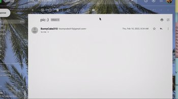 Movie still from “Missing” (2023), directed by Nicholas D. Johnson – An image of an email on a computer screen; Extreme Wide shot, Overhead angle