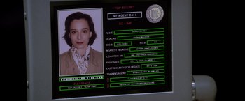 Movie still from “Mission: Impossible” (1996), directed by Brian De Palma – A computer screen with a picture of a woman; Close Up shot, High angle