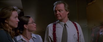 Movie still from “Mission: Impossible” (1996), directed by Brian De Palma – A man and a woman standing next to each other; Close Up shot, Low angle