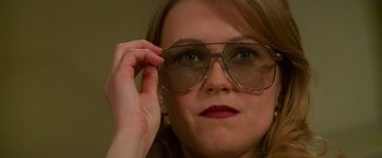 Movie still from “Mission: Impossible” (1996), directed by Brian De Palma – A person wearing a pair of glasses; Close Up shot, Over the shoulder angle