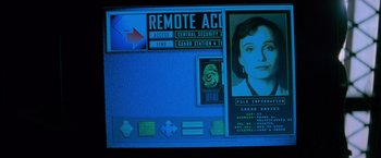 Movie still from “Mission: Impossible” (1996), directed by Brian De Palma – A computer screen showing a woman's face on a computer screen; Extreme Close Up shot, Overhead angle