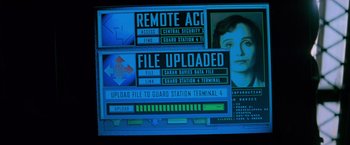 Movie still from “Mission: Impossible” (1996), directed by Brian De Palma – A computer screen with a person's face on it; Extreme Close Up shot, Overhead angle