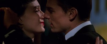 Movie still from “Mission: Impossible” (1996), directed by Brian De Palma – A man and a woman are kissing each other; Close Up shot, Over the shoulder angle