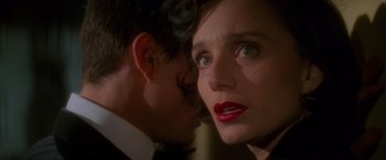 Movie still from “Mission: Impossible” (1996), directed by Brian De Palma – A man and a woman looking at each other; Close Up shot, Over the shoulder angle