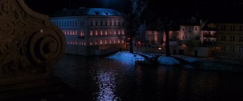 Movie still from “Mission: Impossible” (1996), directed by Brian De Palma – A boat is in the water next to a building; Extreme Wide shot, High angle