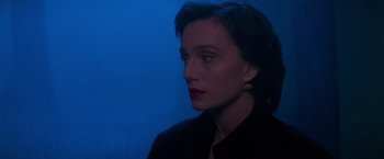 Movie still from “Mission: Impossible” (1996), directed by Brian De Palma – A person wearing a black jacket; Close Up shot, Over the shoulder angle