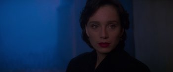 Movie still from “Mission: Impossible” (1996), directed by Brian De Palma – A person wearing a black jacket; Close Up shot, Over the shoulder angle