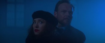 Movie still from “Mission: Impossible” (1996), directed by Brian De Palma – A man and a woman standing next to each other in the dark; Close Up shot, Low angle