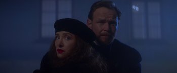 Movie still from “Mission: Impossible” (1996), directed by Brian De Palma – A man and a woman standing next to each other; Close Up shot, Low angle