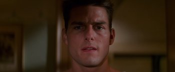 Movie still from “Mission: Impossible” (1996), directed by Brian De Palma – A young man's face in the dark; Close Up shot, Low angle