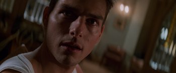 Movie still from “Mission: Impossible” (1996), directed by Brian De Palma – A man's face in a dark room; Close Up shot, Low angle